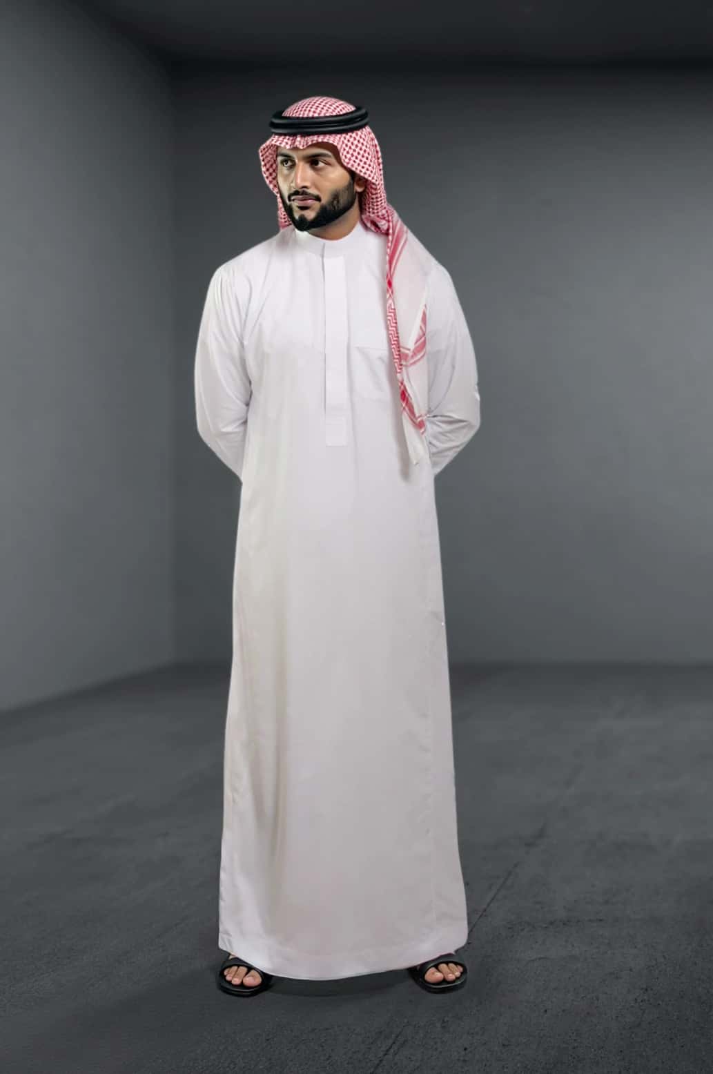 A man wearing the classic White Saudi Thobe from the Elite Edition. 2