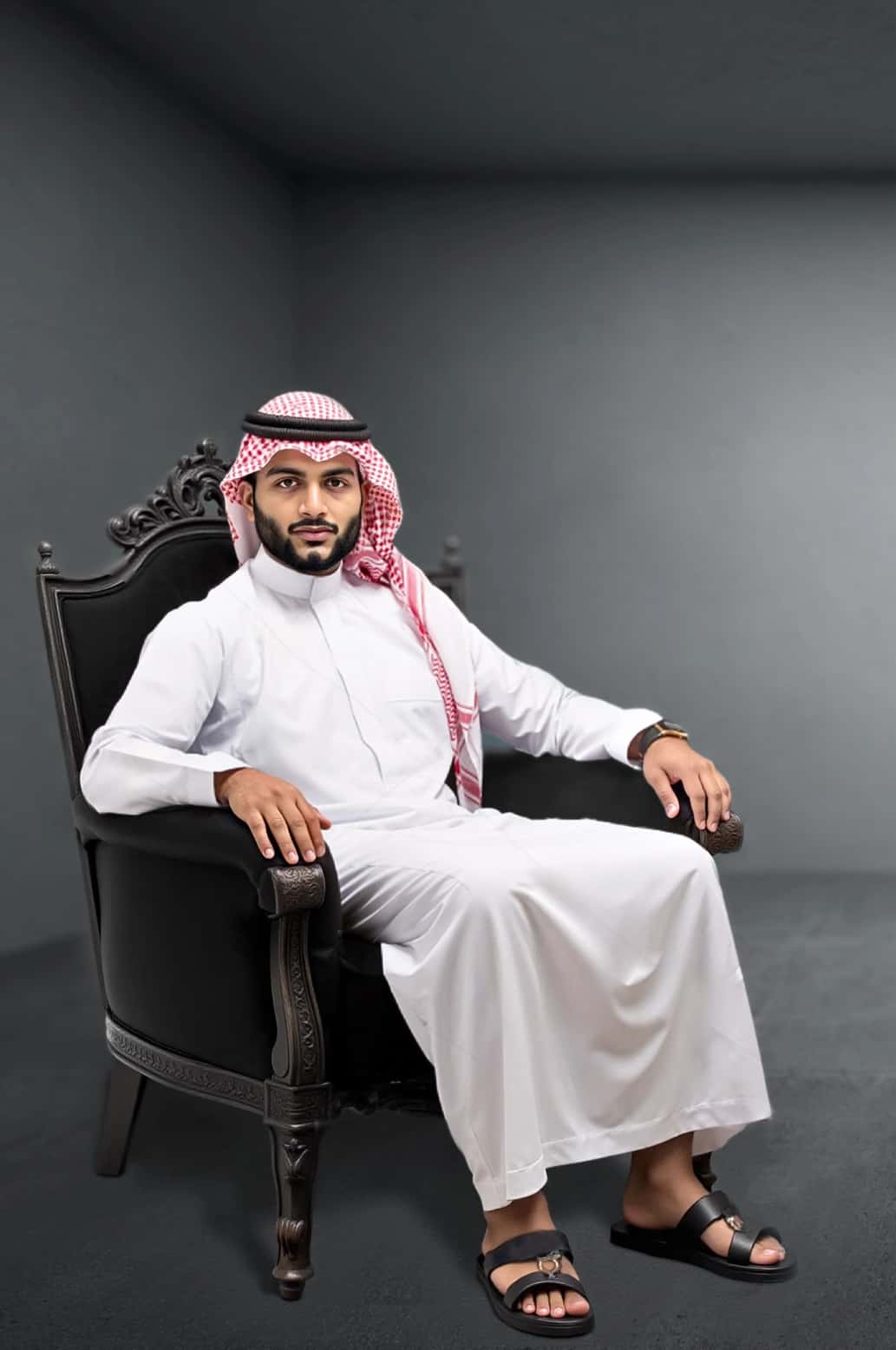 A man wearing the classic White Saudi Thobe from the Elite Edition. 3