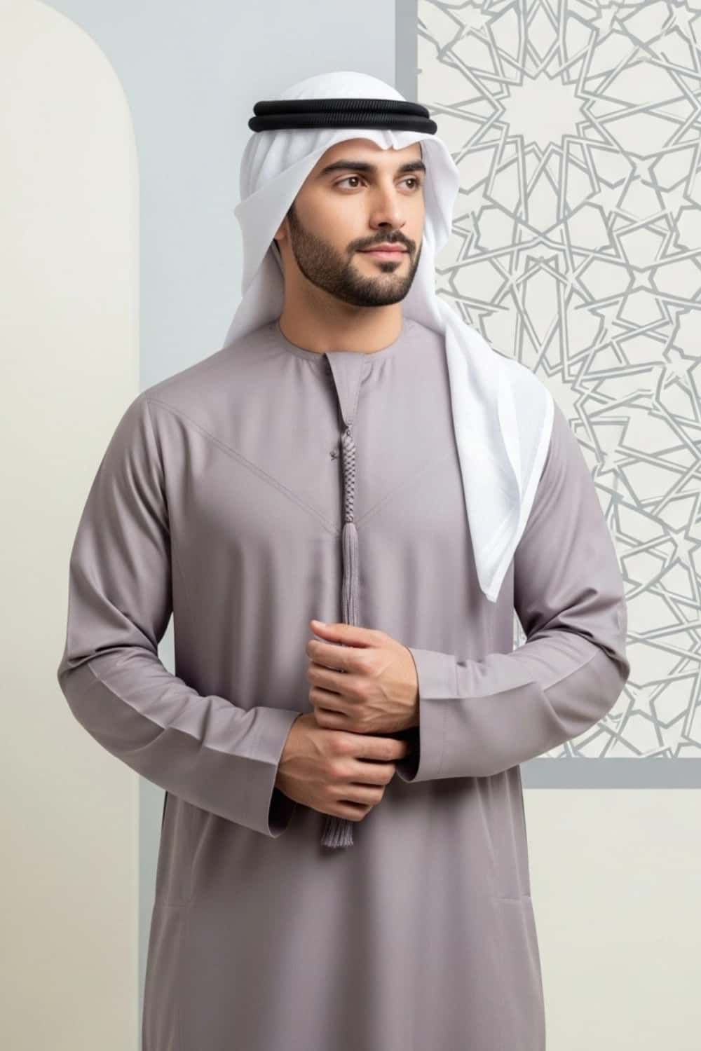 A man wearing the unique and sophisticated Warm Plum Kandura. 3