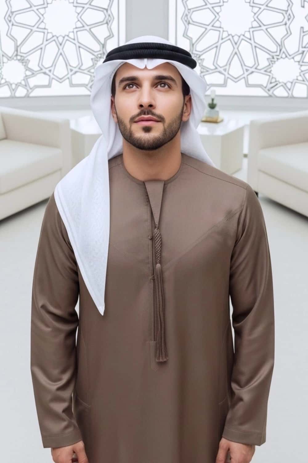 A man wearing the rich Royal Brown Kandora, suitable for all seasons. 4
