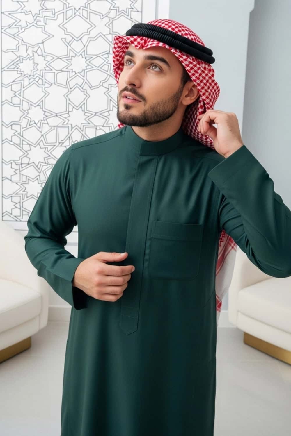 A man wearing the distinguished Midnight Green Saudi Thobe for winter. 3