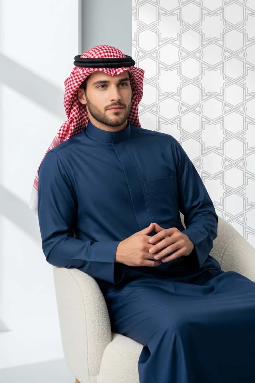 A man wearing the deep and sophisticated Midnight Blue Thobe. 3