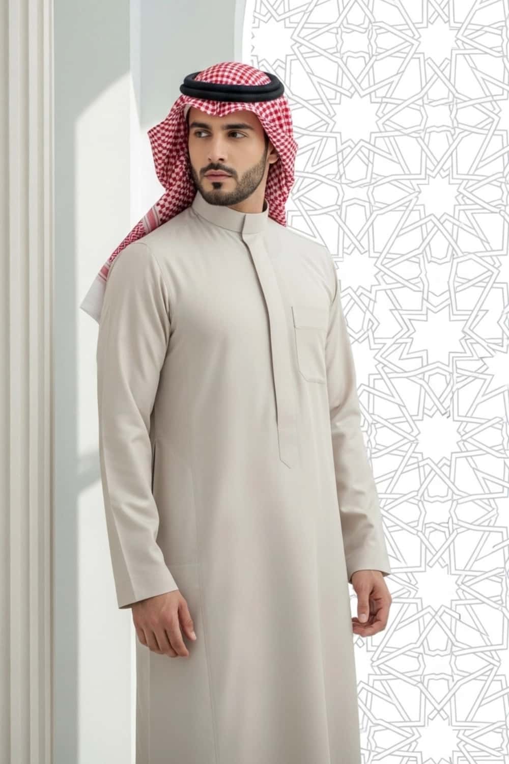 A man wearing the versatile and elegant Light Beige Thobe. 2