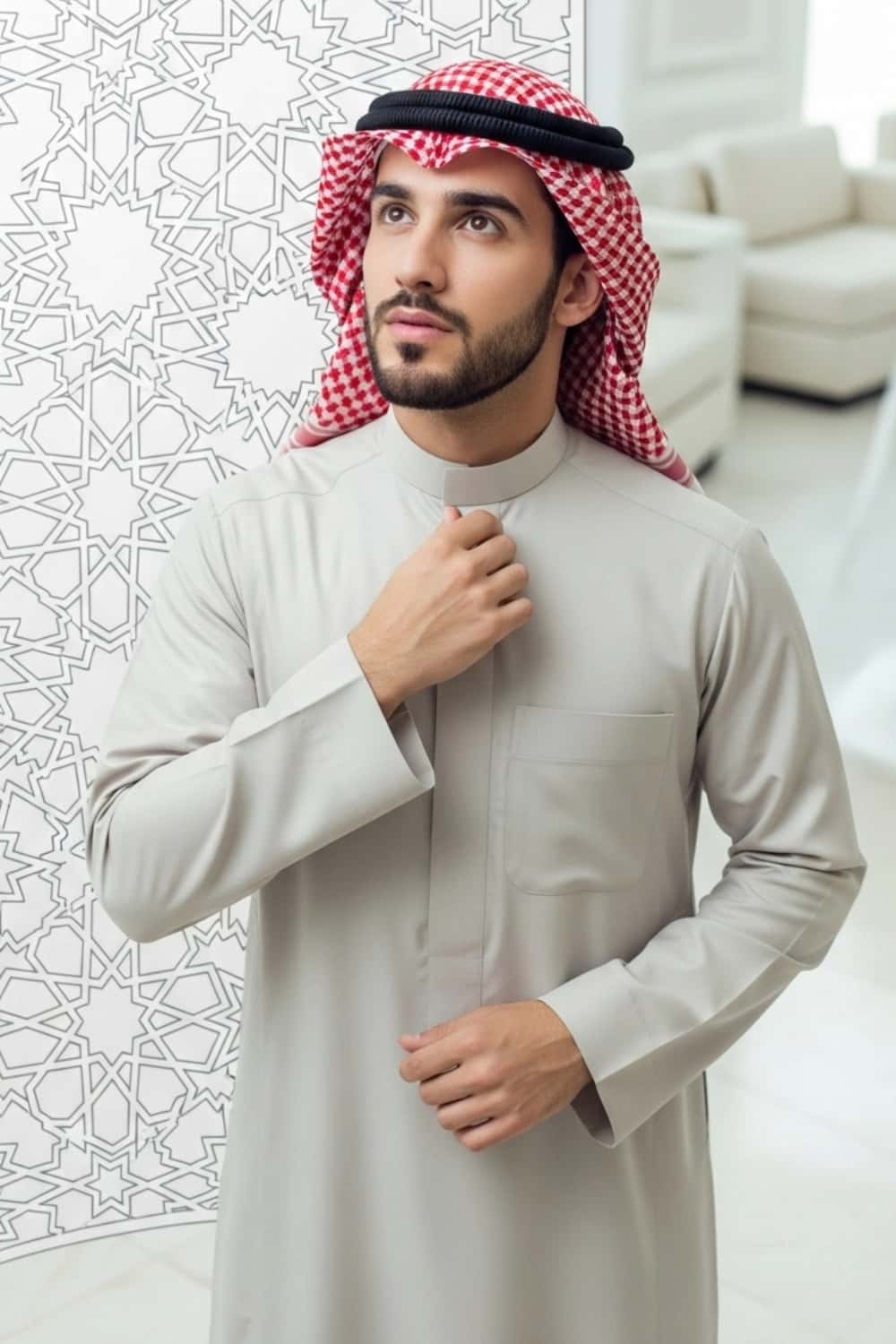 A man wearing the versatile and elegant Light Beige Thobe. 4