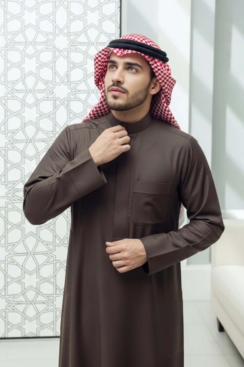 A man wearing the warm and rich Dark Brown Winter Saudi Thobe. 4