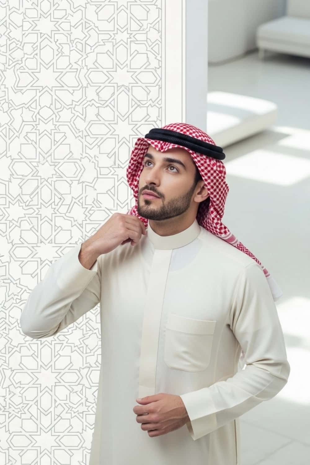 A man wearing the elegant and clean Cream Saudi Thobe. 2