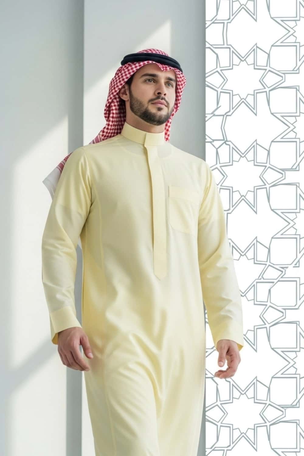 A man wearing the light and fresh Pale Lemon Saudi Thobe. 3