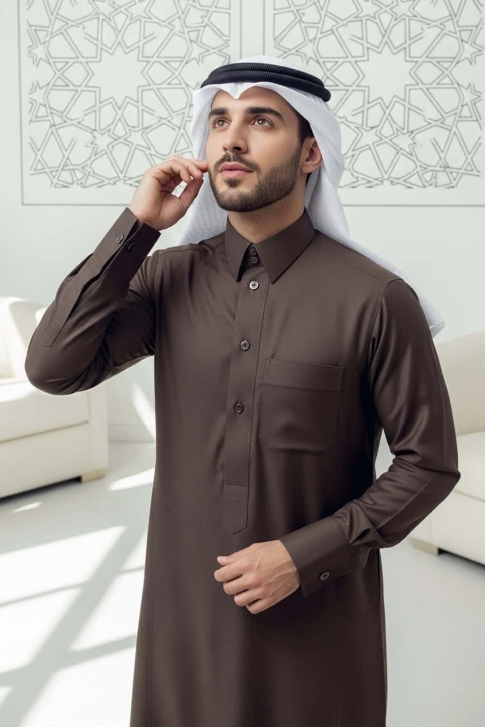 A man wearing the earthy and elegant Brown Qatari Thobe with fine fabric. 3