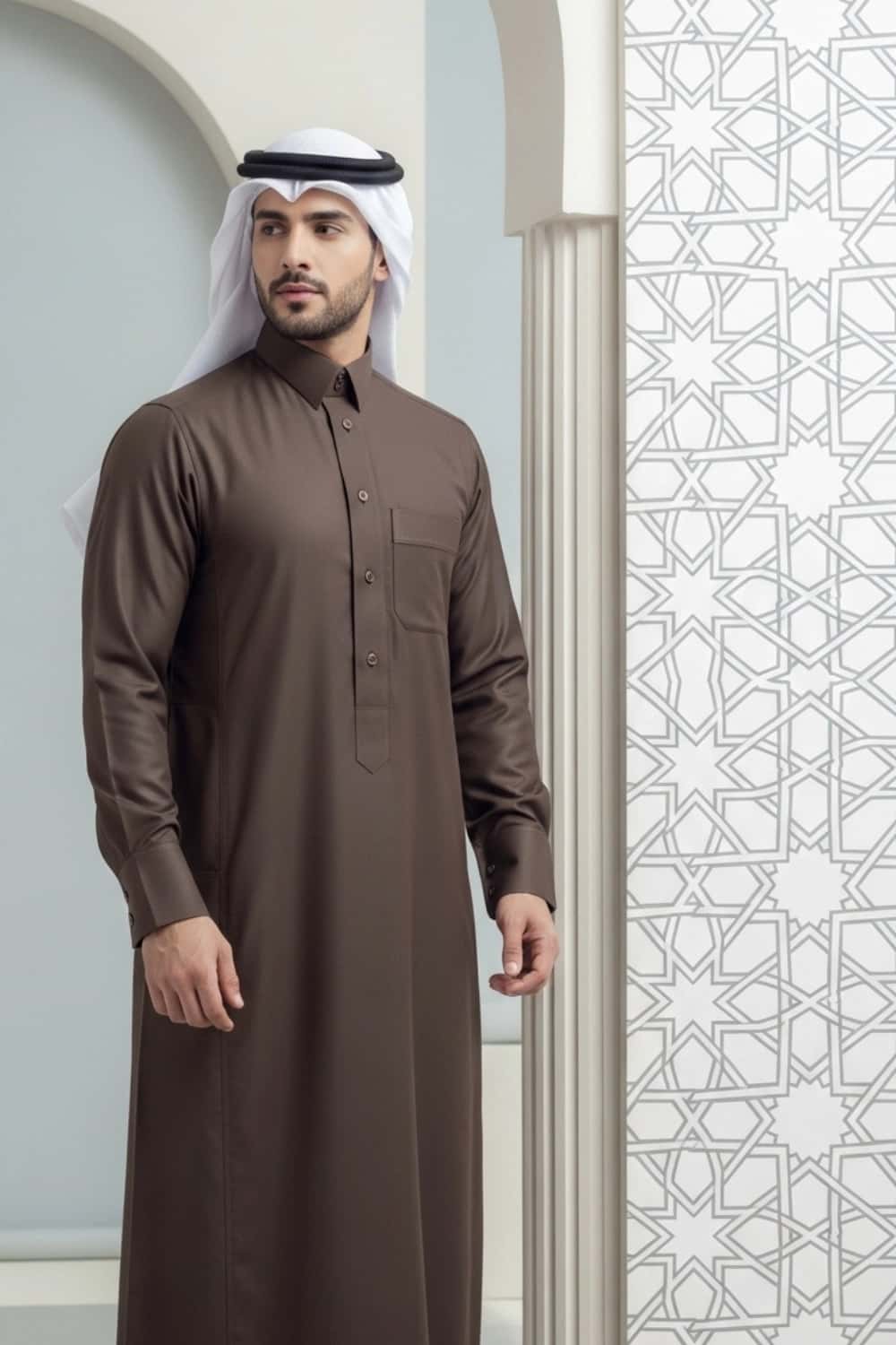 A man wearing the earthy and elegant Brown Qatari Thobe with fine fabric. 4