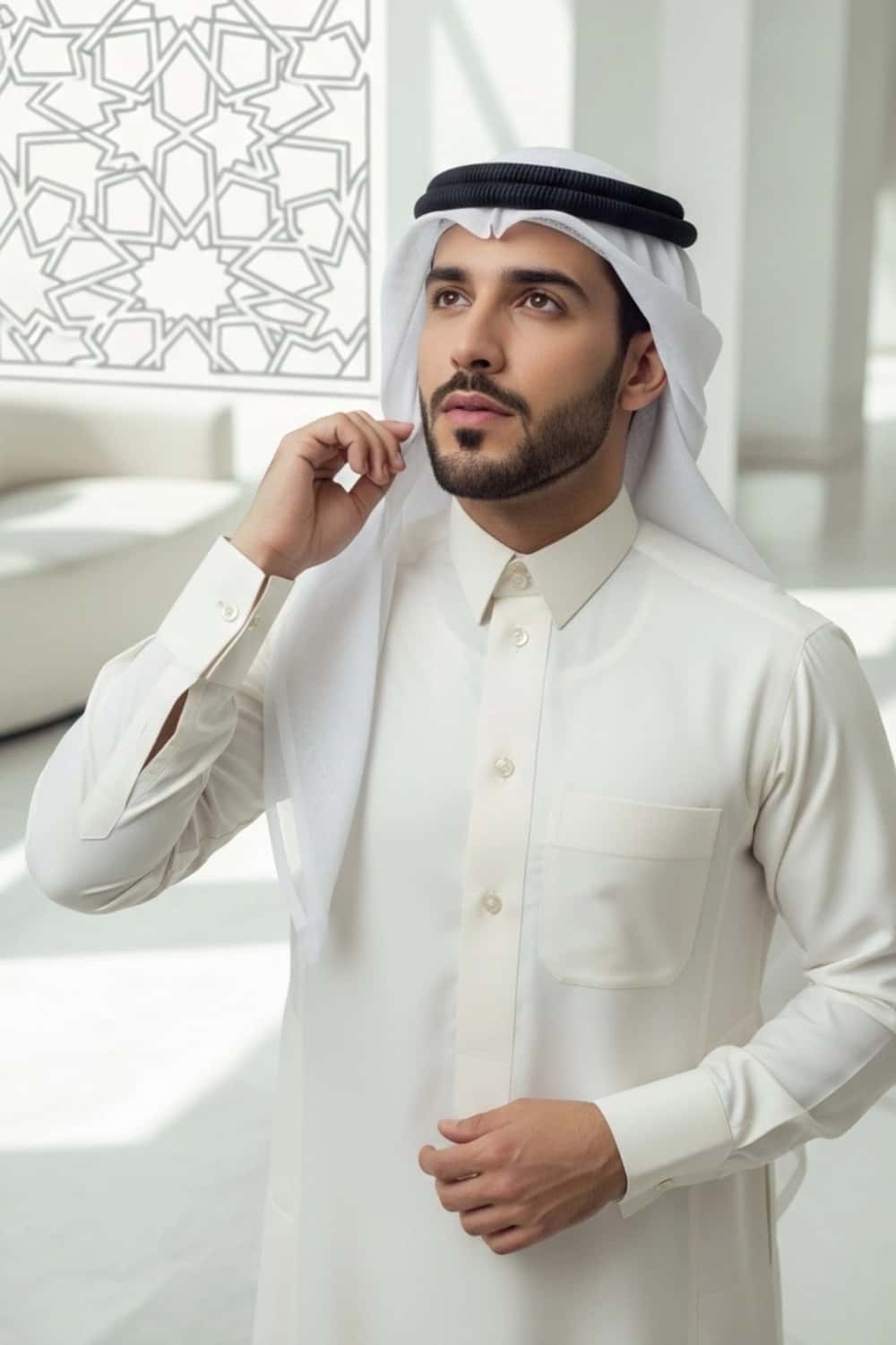 A man wearing the sharp and sophisticated Cream Qatari Thobe. 3
