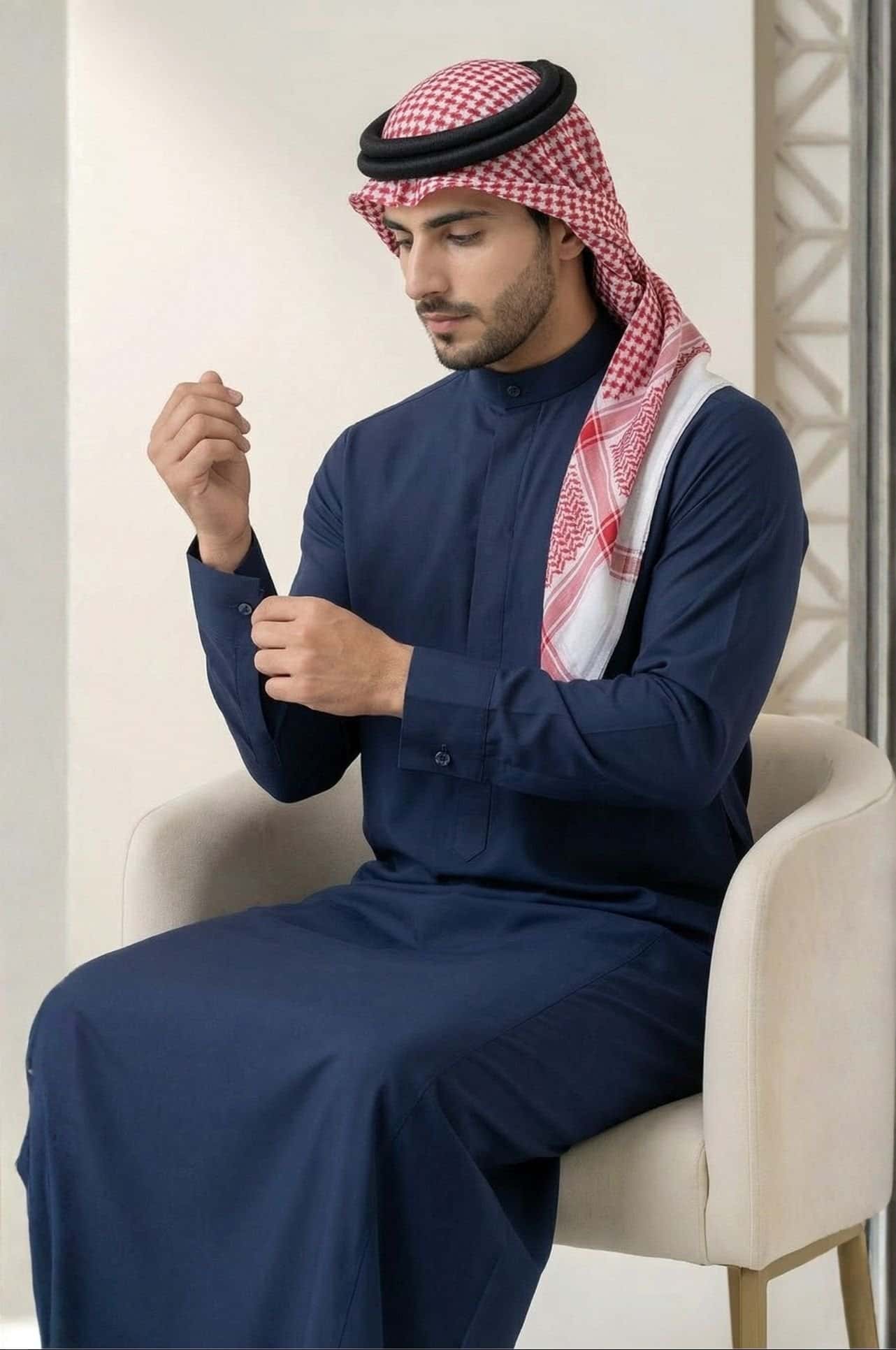 Man in royal navy blue Kuwaiti dishdasha from Shabab al Yola, showing clean lines and premium fabric for winter wear in Abu Dhabi 5