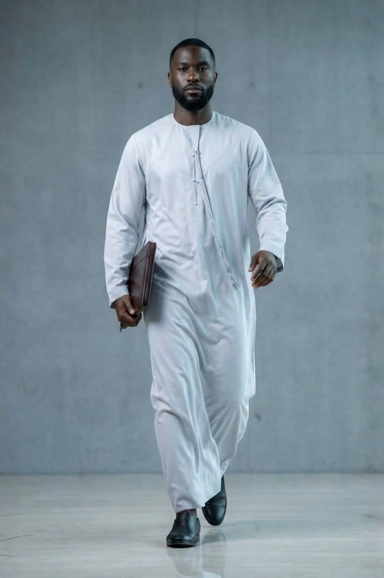 Modern professional wearing an ice grey kandora against Abu Dhabi's contemporary skyline, representing future luxury in traditional dress. 2
