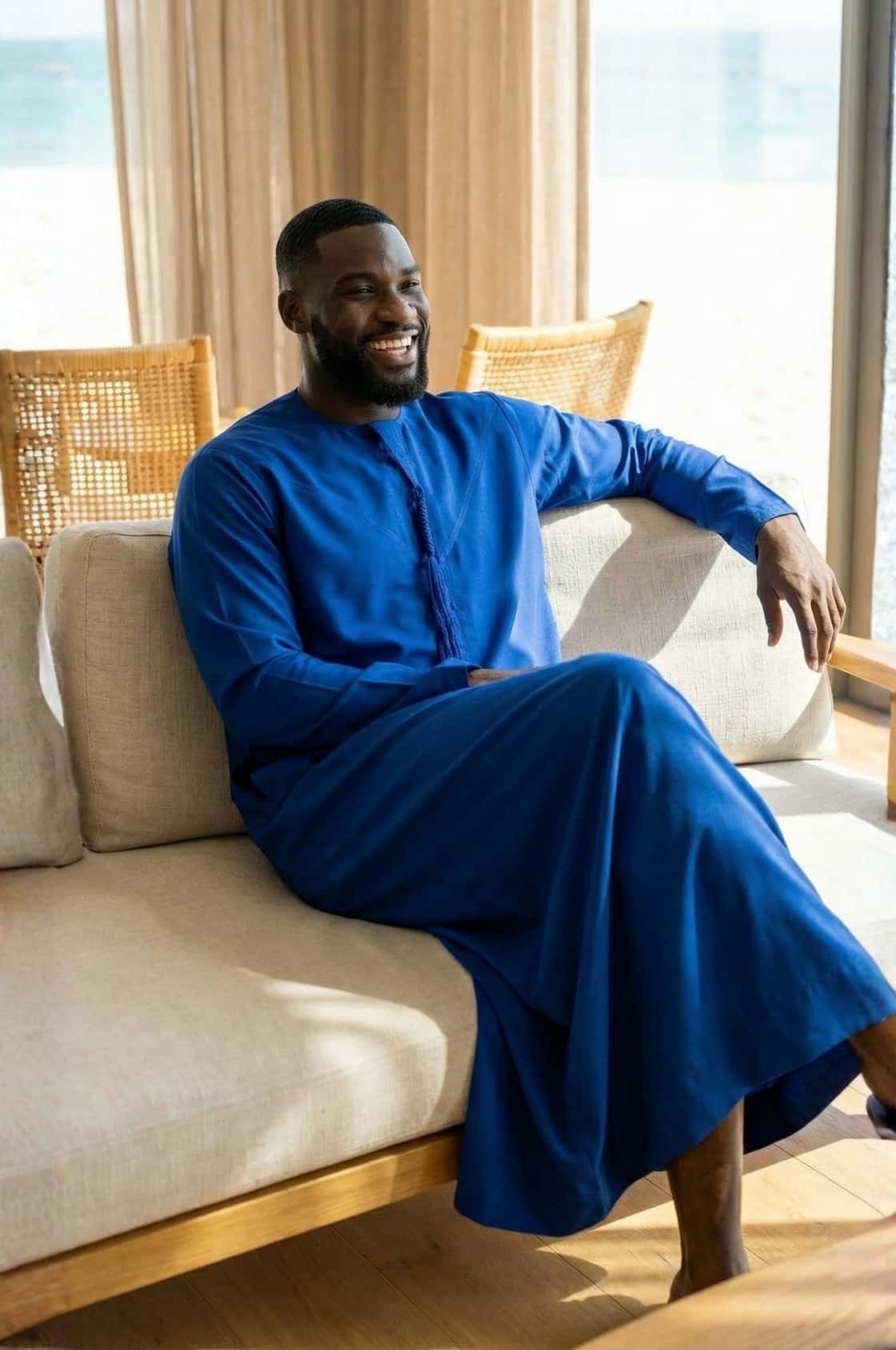 Distinguished gentleman wearing a royal blue kandora at a luxury Abu Dhabi venue, embodying regal elegance in traditional dress. 2