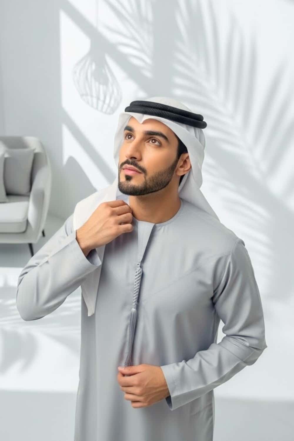 Gentleman wearing Silver Grey Montgomery Wool Kandora displaying the luminous polished tone and refined English wool finish from Shabab al Yola Winter Collection 5