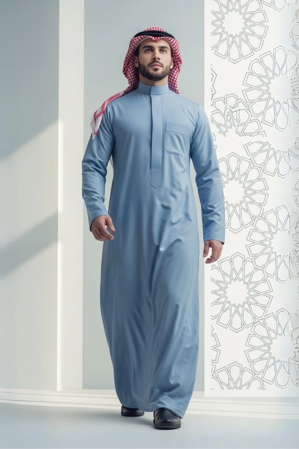 A man wearing the calm and confident Powder Blue Saudi Thobe.