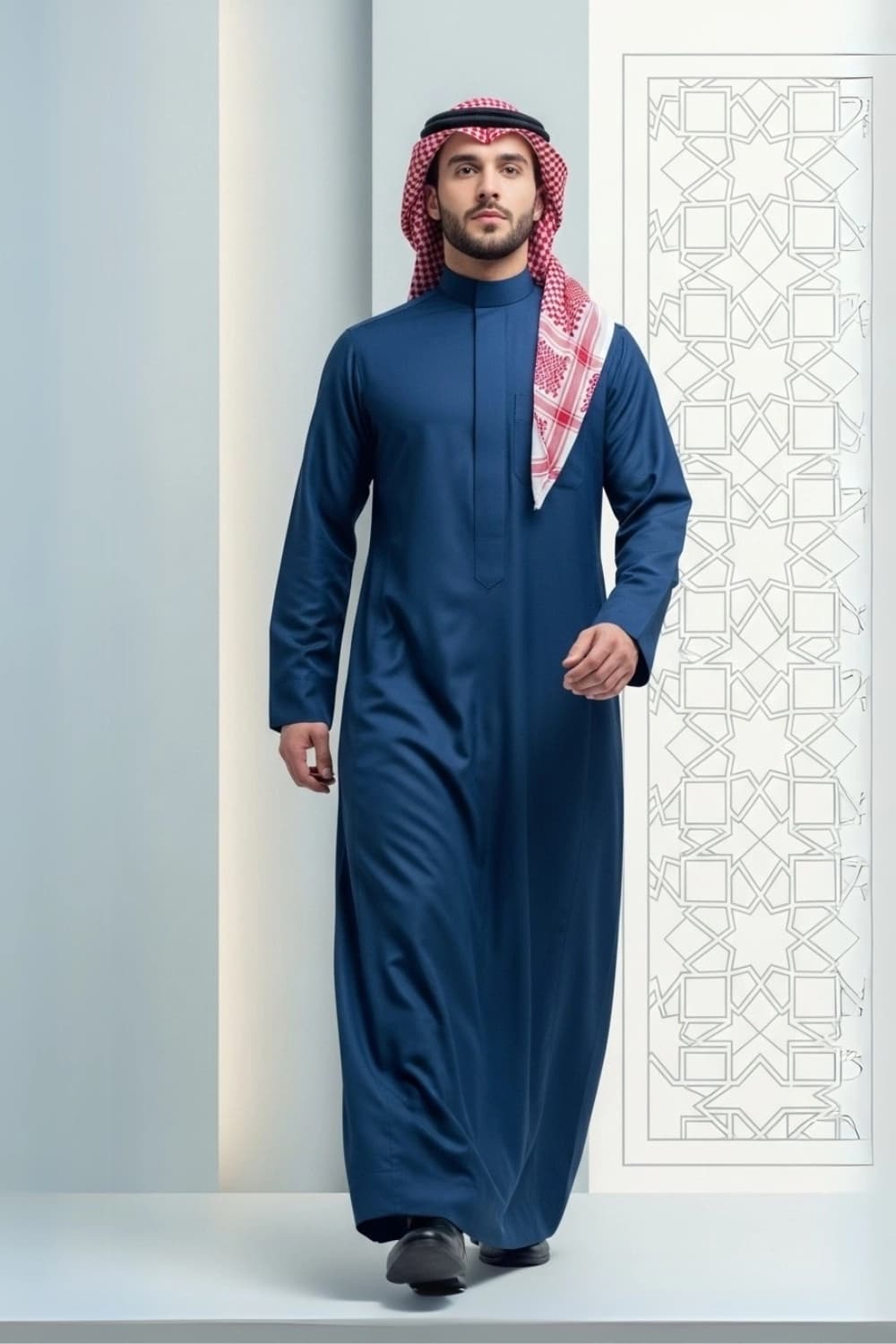 A man wearing the deep and sophisticated Midnight Blue Thobe.