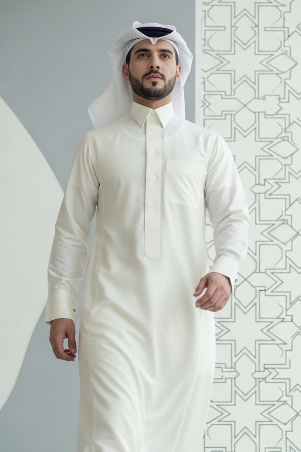 A man wearing the sharp and sophisticated Cream Qatari Thobe.