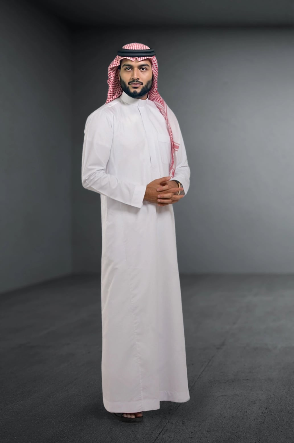 A man wearing the classic White Saudi Thobe from the Elite Edition. 1