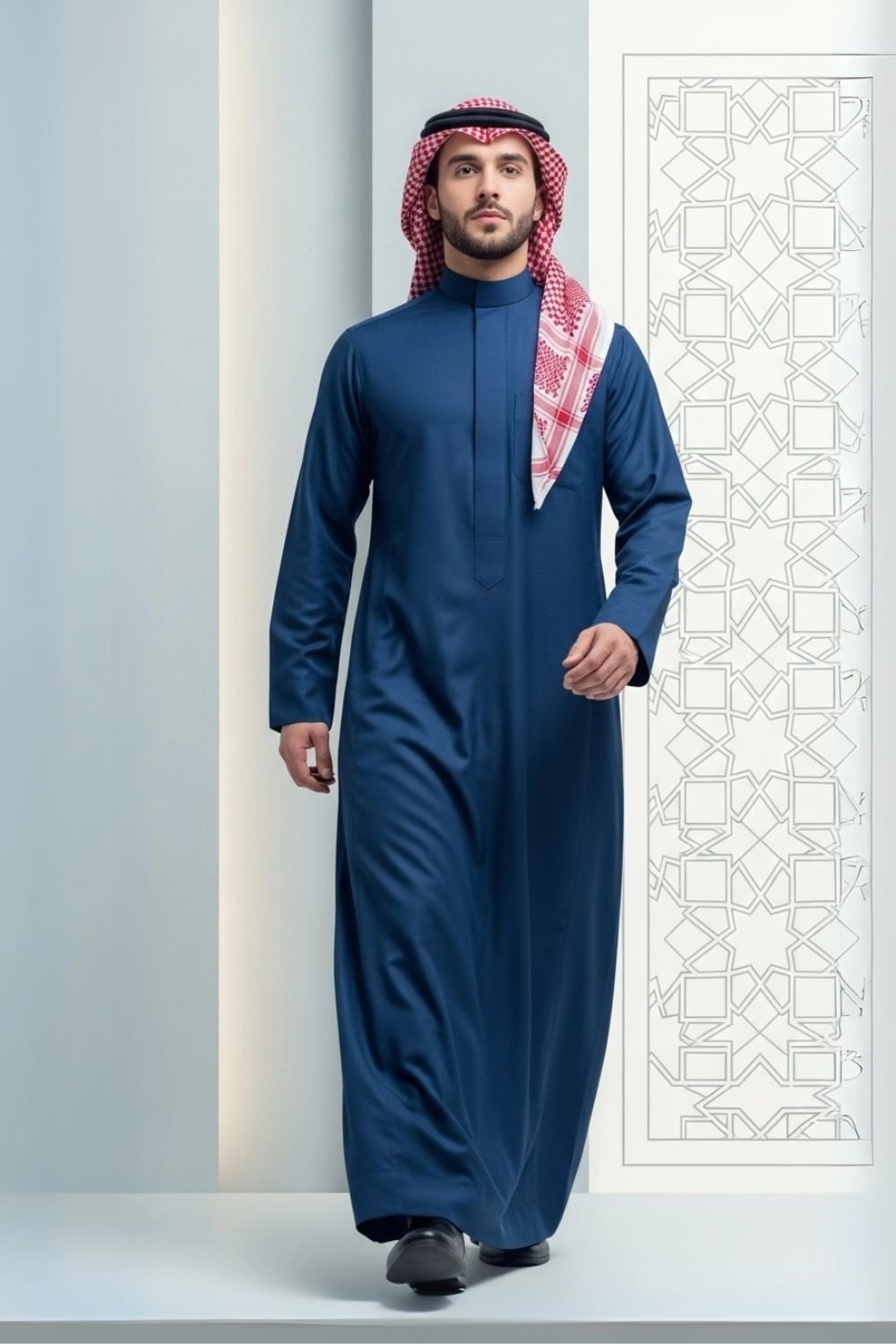 A man wearing the deep and sophisticated Midnight Blue Thobe. 1