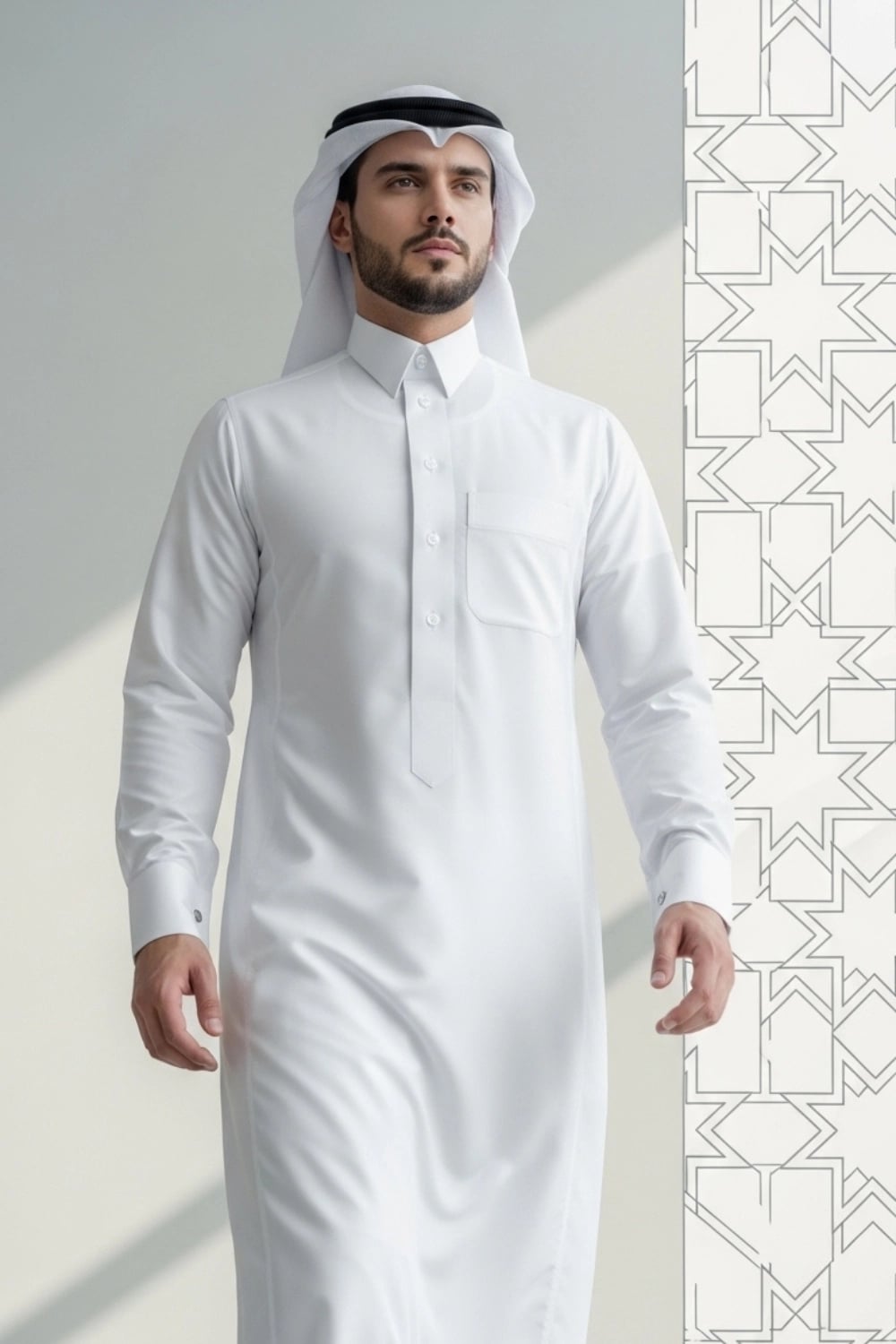 A man wearing the pristine White Qatari Thobe from the Elite Edition. 1