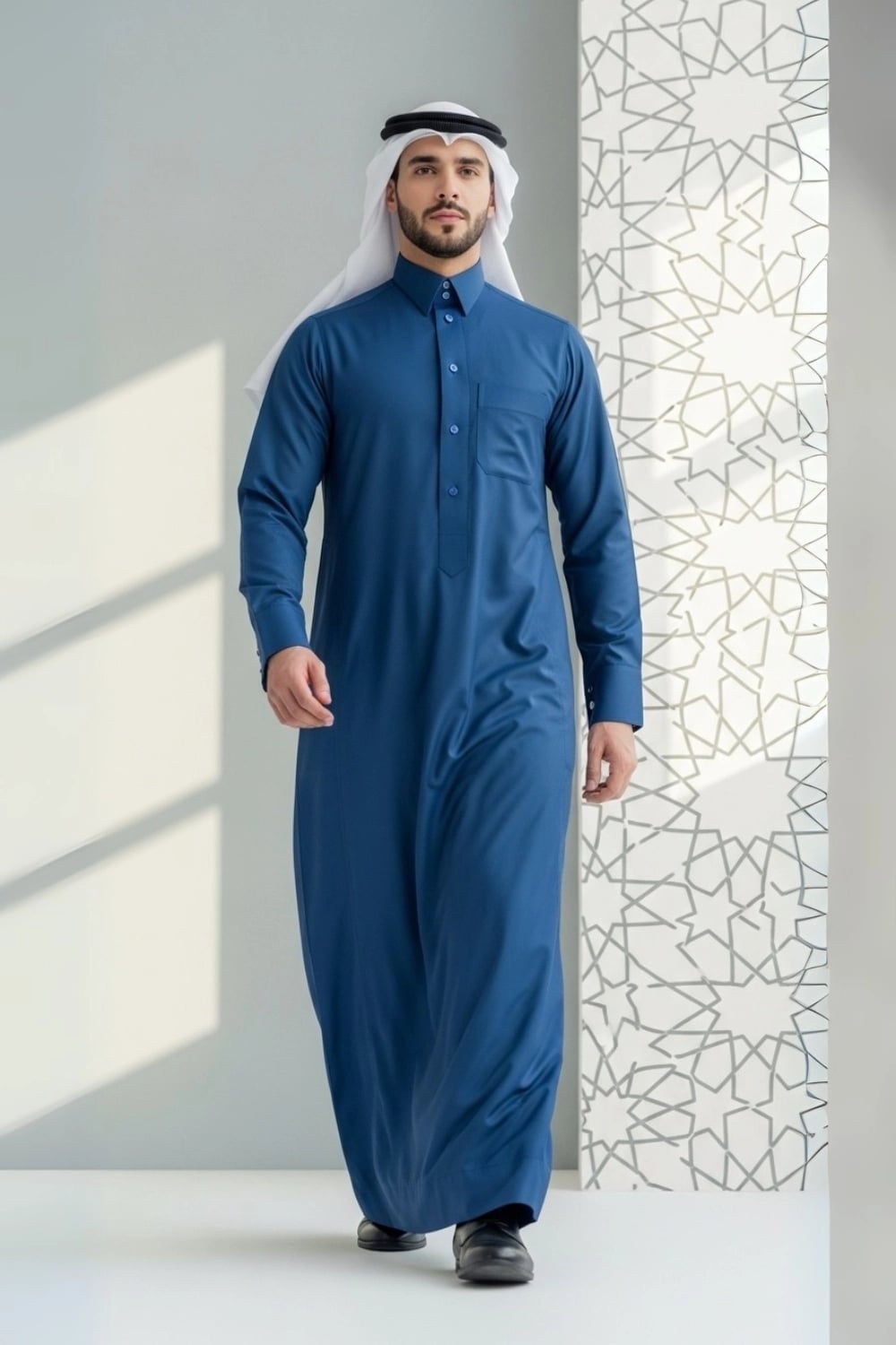 A man wearing the distinct Blue Qatari Thobe from the Stellar Edition. 1