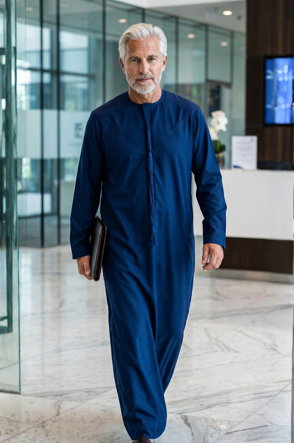 Distinguished senior executive wearing a royal navy blue winter kandora at a luxury Abu Dhabi evening event, commanding presence and authority. 1