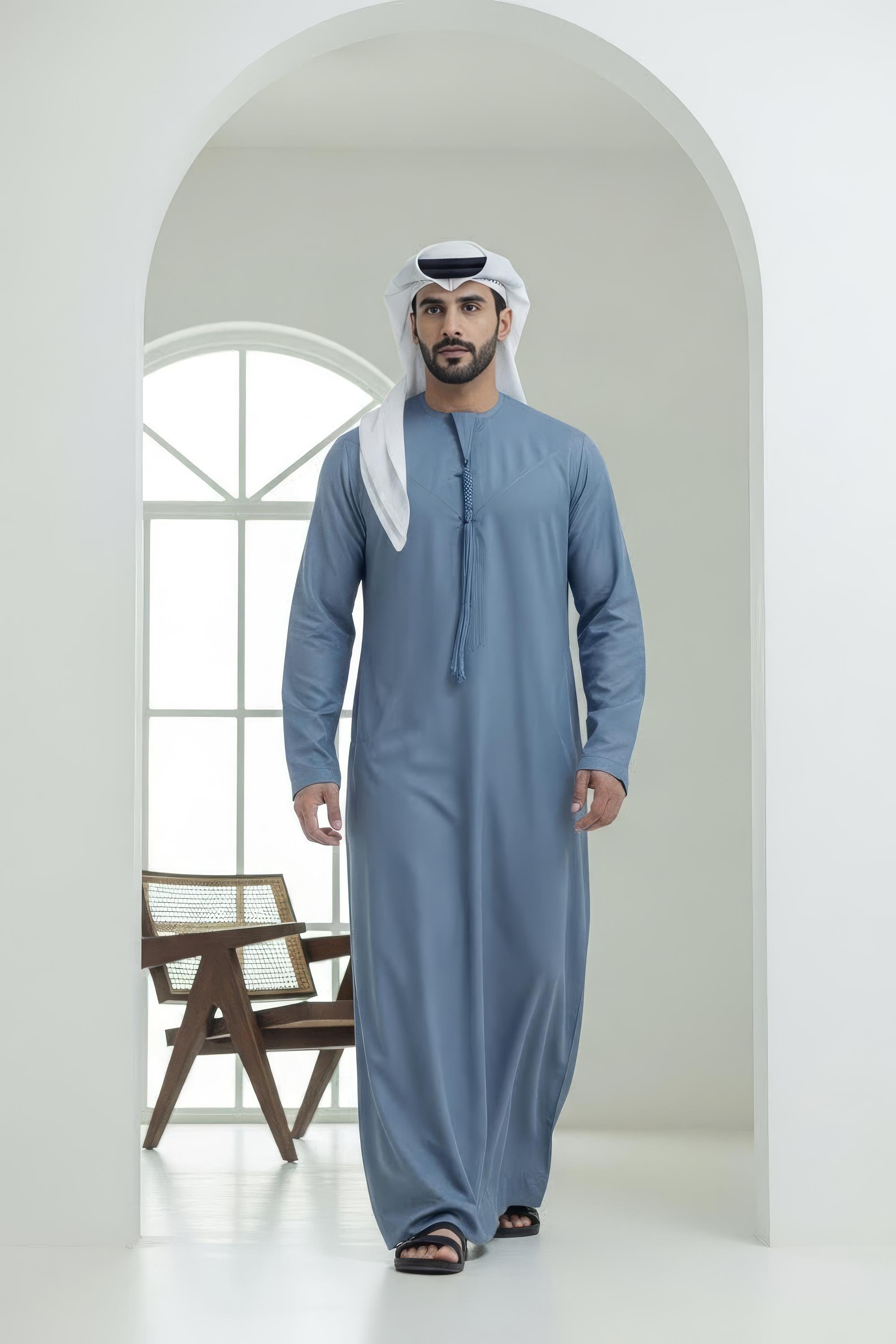 Executive wearing Air Force Blue Montgomery Wool Kandora showcasing the confident structured tone and premium English wool drape from Shabab al Yola Winter Collection 1