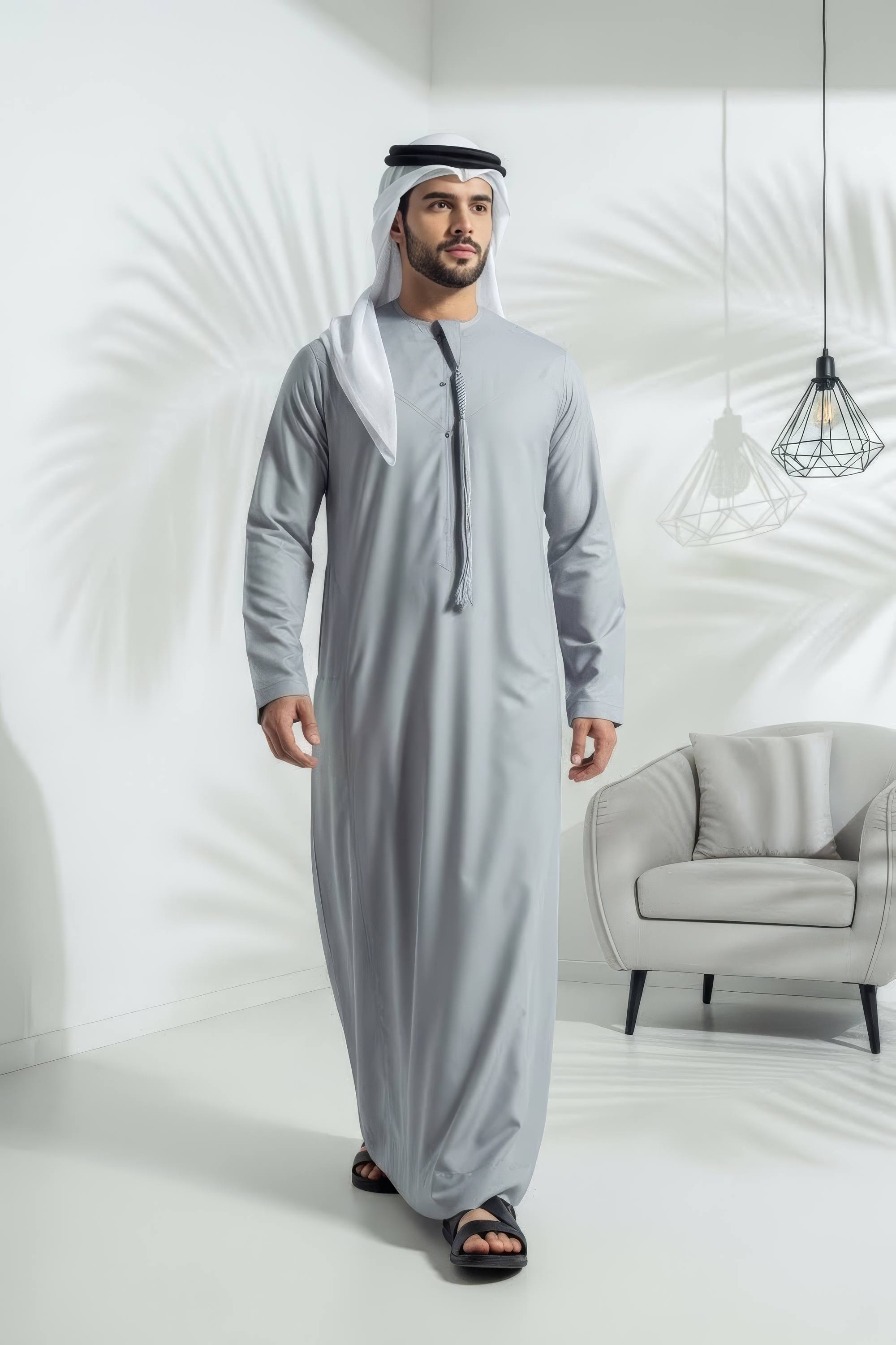 Gentleman wearing Silver Grey Montgomery Wool Kandora displaying the luminous polished tone and refined English wool finish from Shabab al Yola Winter Collection 1